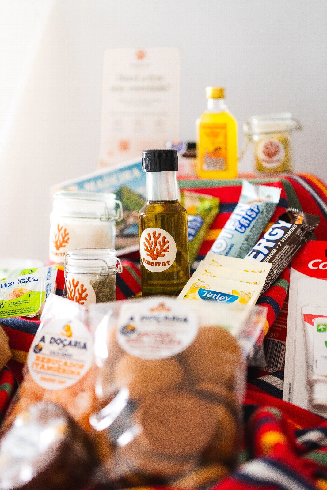 Sustainable kitchen ingredients arranged on a warm wooden table